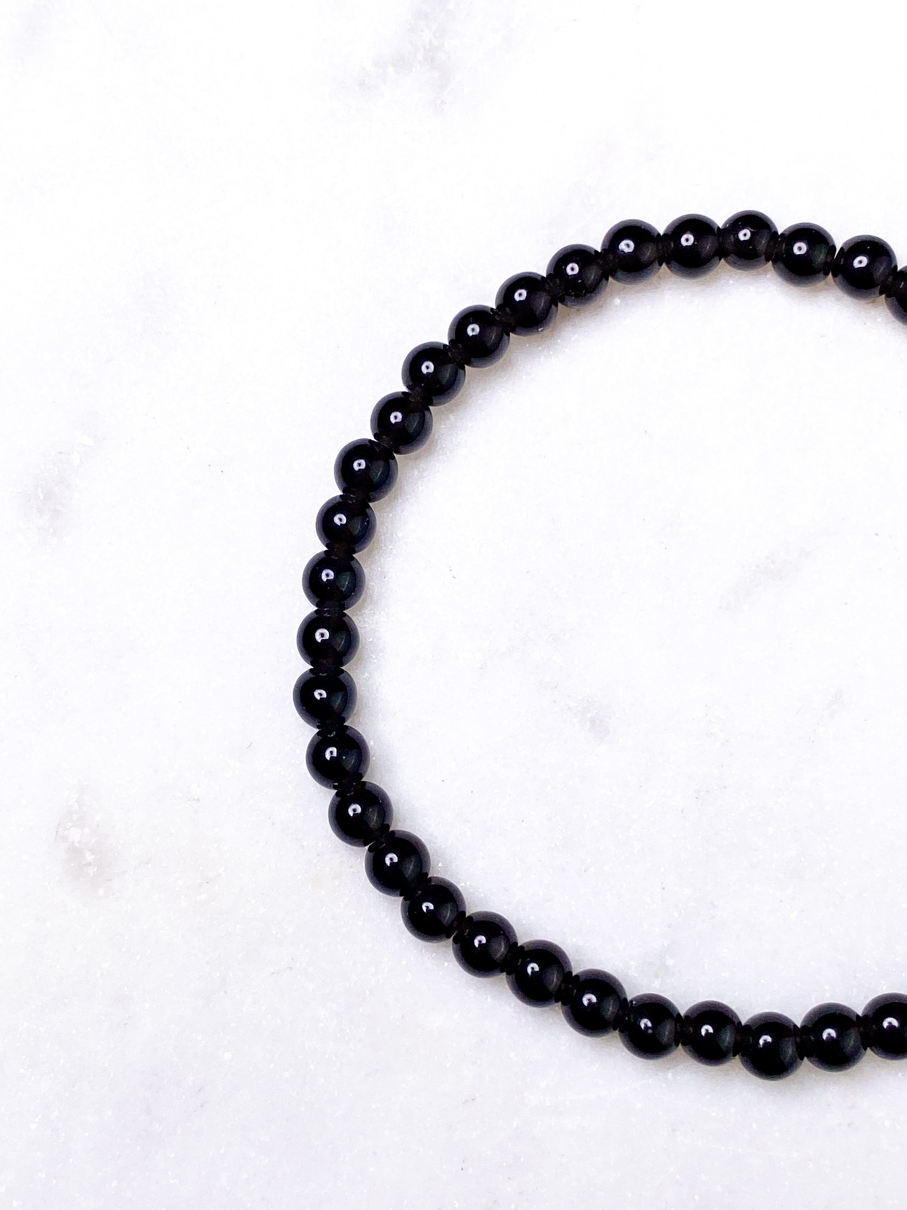 Svart obsidianarmband