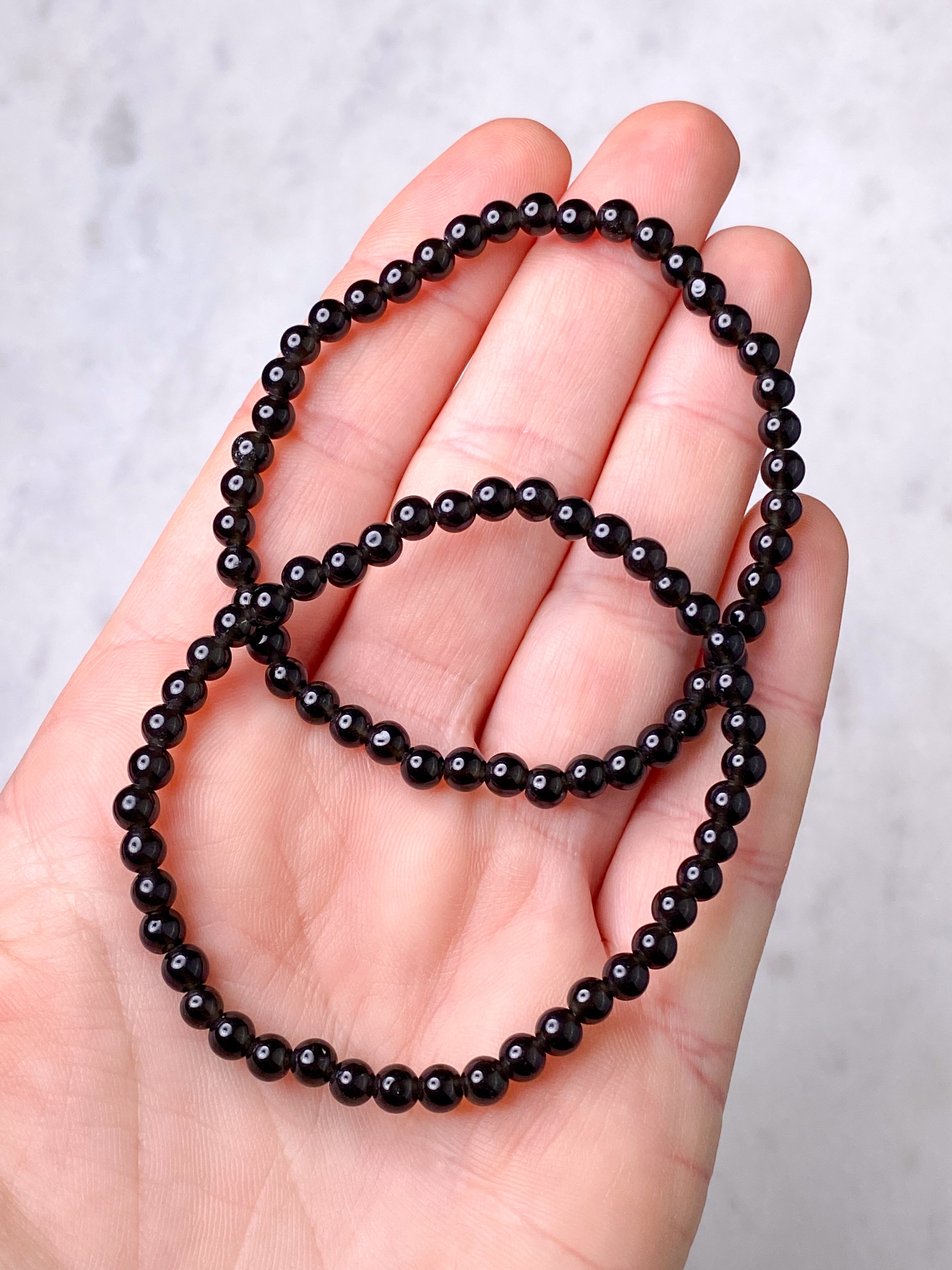 Svart obsidianarmband