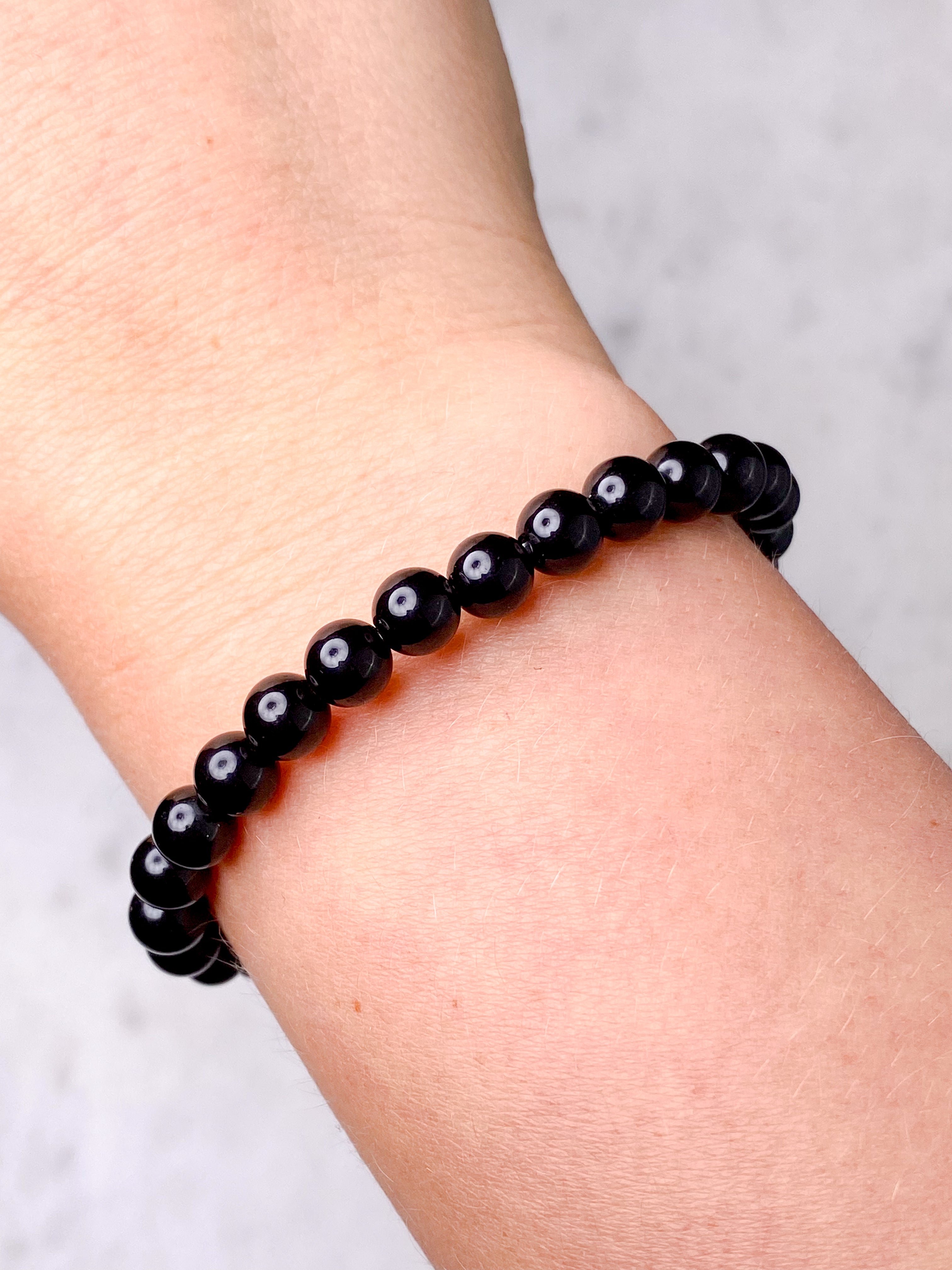 Svart obsidianarmband