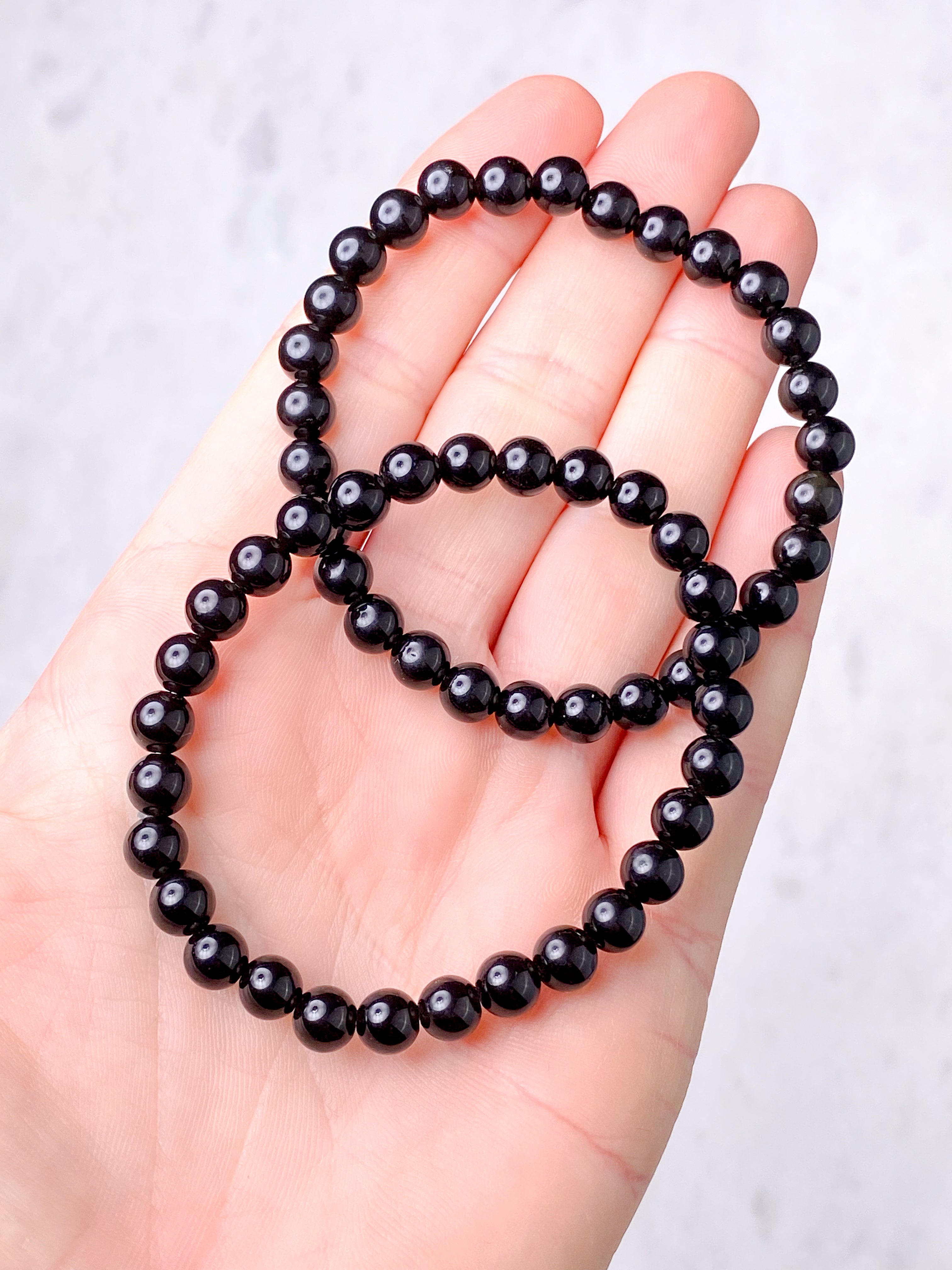 Svart obsidianarmband